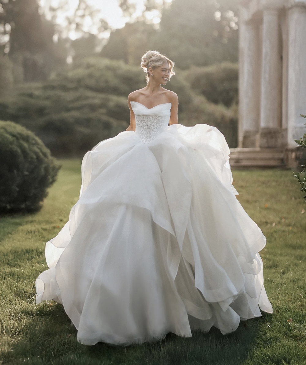 Bride in a white ballgown wedding dress outdoors